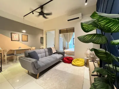 a living room with a couch and a table at Arte Mont Kiara by RKD HOME in Kuala Lumpur