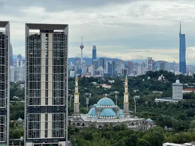 a view of a building with a city in the background at Arte Mont Kiara by RKD HOME in Kuala Lumpur