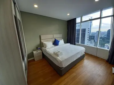 a bedroom with a bed and a large window at Vortex KLCC Area in Kuala Lumpur