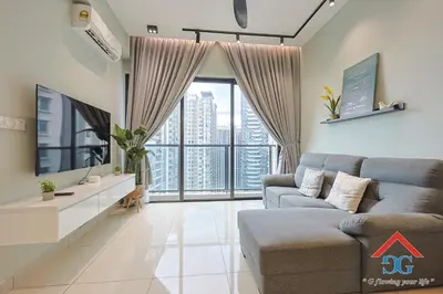 a living room with a couch and a large window at Astoria Ampang By Grabstay in Kuala Lumpur