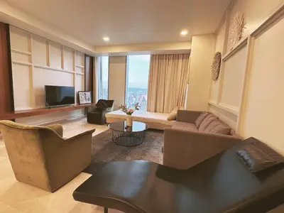 a living room with a couch and a tv at Tropicana The Residence By Klcc in Kuala Lumpur