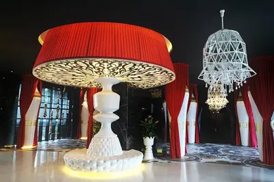 a table with a red and white lamp on a table at HappyHome @ Arte Mont Kiara Kuala Lumpur Hartamas Damansara in Kuala Lumpur