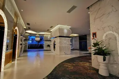 a large lobby with a staircase and a building at HappyHome @ Arte Mont Kiara Kuala Lumpur Hartamas Damansara in Kuala Lumpur