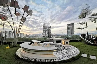 a park with a fountain in a city at HappyHome @ Arte Mont Kiara Kuala Lumpur Hartamas Damansara in Kuala Lumpur