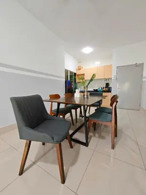 a dining room with a table and chairs in a kitchen at Razak City Residence at Sungai Besi, Kuala Lumpur by Liberty Homes in Kuala Lumpur