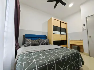 a bedroom with a bed and a ceiling fan at Razak City Residence at Sungai Besi, Kuala Lumpur by Liberty Homes in Kuala Lumpur