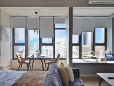 a living room with a view of a city at Ceylonz Suites KL Studio near Bukit Bintang - Living Signature in Kuala Lumpur
