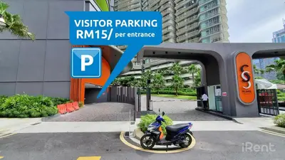 a motorcycle parked in front of a building at Sky Suites with KLCC Twin Tower View by iRent365 in Kuala Lumpur