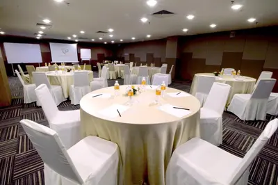 a banquet hall with white tables and white chairs at Seeds Hotel Premier Pudu Kuala Lumpur Previously Hotel Pudu Plaza KL in Kuala Lumpur