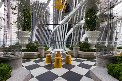 a checkered floor in a building with yellow objects on it at Arte Mont Kiara Homestay in Kuala Lumpur