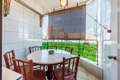 a dining room with a table and chairs and a window at Fahrenheit88 - China Theme Kuala Lumpur Bukit Bintang in Kuala Lumpur
