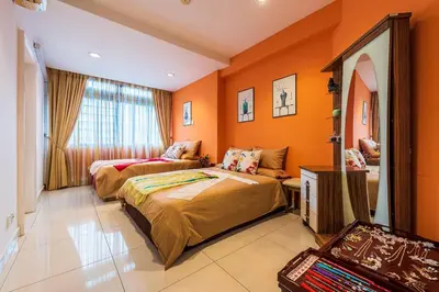 a bedroom with two beds and a couch in it at Fahrenheit88 - China Theme Kuala Lumpur Bukit Bintang in Kuala Lumpur