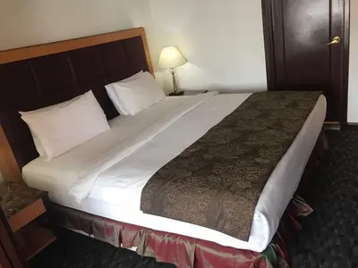a large bed in a hotel room at Fantazya Suites Times Square in Kuala Lumpur