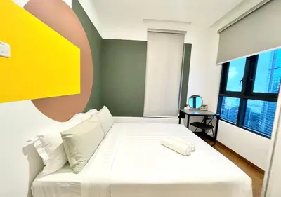 a bedroom with a white bed and a large window at KL Gateway Premium Residences by Moka in Kuala Lumpur