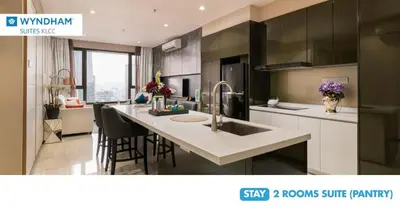 a kitchen with a sink and a counter top at Wyndham Suites KLCC in Kuala Lumpur