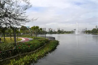 a view of a lake in a city with a fountain at Titiwangsa Cabin Retreats by Vale Pine in Kuala Lumpur