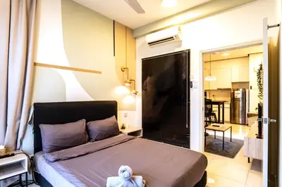a bedroom with a bed with a stuffed animal on it at Arte Mont Kiara by Airhost in Kuala Lumpur