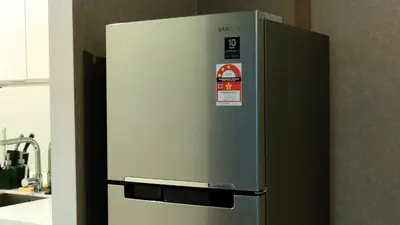a stainless steel refrigerator in a kitchen at KLCC Homestay Vacation Sky Suites KLCC Birdy Stay in Kuala Lumpur