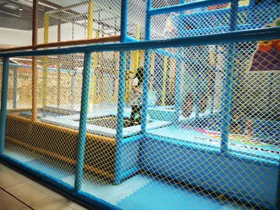 a batting cage with blue metal fencing at Aishiteru Homestay in Kuala Lumpur