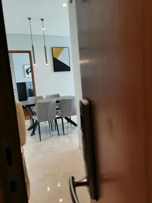a room with a table and chairs and a door at Sky Suites KLCC by Autumn Suites Premium Stay in Kuala Lumpur