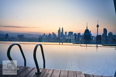 a view of a city skyline from a swimming pool at Regalia Residence @ KLCC View Sky Pool by KC in Kuala Lumpur