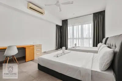 a hotel room with a bed and a sink at Regalia Residence @ KLCC View Sky Pool by KC in Kuala Lumpur
