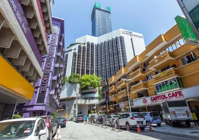 a city street with cars parked on the street at 33 Star Hotel by The Awinka Group Of Management in Kuala Lumpur