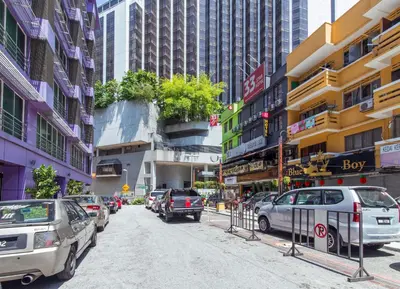 a busy city street with cars parked on the street at 33 Star Hotel by The Awinka Group Of Management in Kuala Lumpur