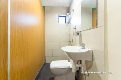 a bathroom with a toilet and a sink at 33 Star Hotel by The Awinka Group Of Management in Kuala Lumpur