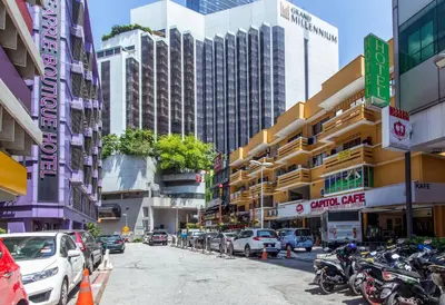 a city street with parked cars and buildings at 33 Star Hotel by The Awinka Group Of Management in Kuala Lumpur