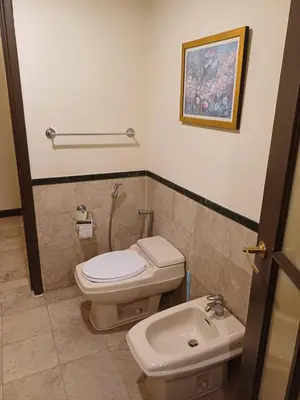 a bathroom with a toilet and a sink at Times Square Grand Service Suite in Kuala Lumpur