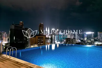 a large swimming pool on top of a city at night at D'Majestic Premier Suites Kuala Lumpur in Kuala Lumpur