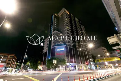 a city at night with a large sign on a building at D'Majestic Premier Suites Kuala Lumpur in Kuala Lumpur