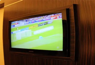 a television screen with a baseball game on it at GOLDEN PALACE in Kuala Lumpur
