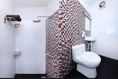 a bathroom with a toilet and a shower at GOLDEN PALACE in Kuala Lumpur