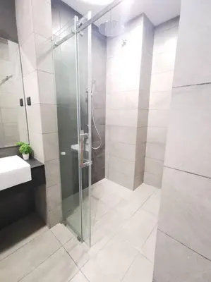 a bathroom with a shower and a sink at OPUS RESIDENCE KL I HomeBrickz in Kuala Lumpur