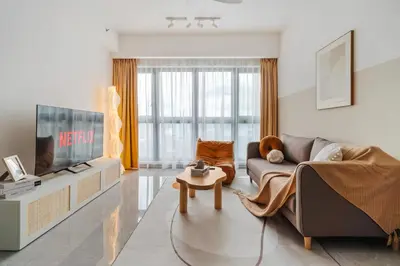 a living room with a couch and a tv at Agile Delima Residence Bukit Bintang in Kuala Lumpur