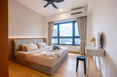 a bedroom with a bed and a window at Agile Delima Residence Bukit Bintang in Kuala Lumpur