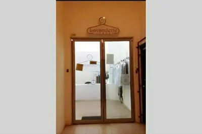 a door to a store with a sign above it at Cozy Regalia KL 吉隆玻 LRT & KTM @1 Parking & WIFI in Kuala Lumpur