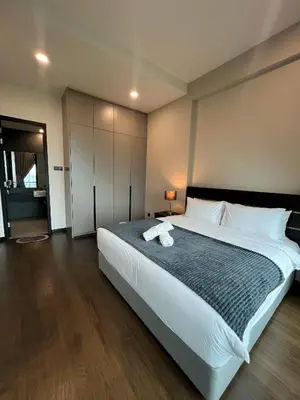 a large bedroom with a large bed with white sheets at Opus Residence KL by EUcation Home in Kuala Lumpur