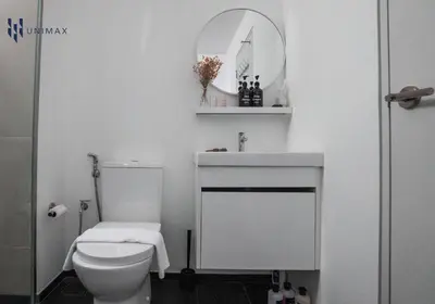 a white bathroom with a toilet and a sink at UNA Sunway Velocity Kuala Lumpur by Unimax in Kuala Lumpur