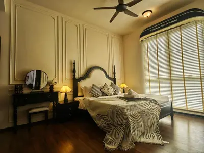 a bedroom with a bed and a ceiling fan at UNA Sunway Velocity Kuala Lumpur by Unimax in Kuala Lumpur