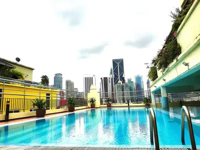 a large swimming pool with a city skyline in the background at Eco One Bedroom Apartment @ Jalan Ampang, 3 pax in Kuala Lumpur