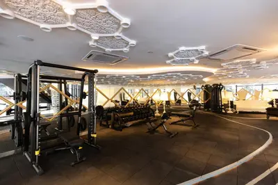 a gym with treadmills and exercise equipment in a building at Near MITEC, Arte Mont Kiara by Cobnb in Kuala Lumpur