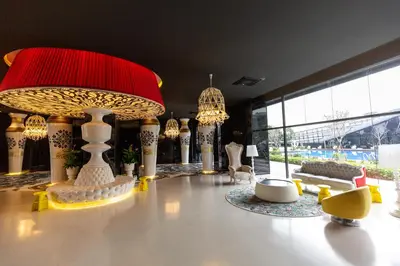 a room with a table with a large red and white object at Near MITEC, Arte Mont Kiara by Cobnb in Kuala Lumpur
