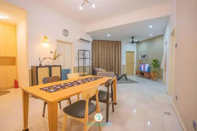 a living room with a table and chairs at Doorstep - Sunway Putra Mall - Close to PWTC for 4 in Kuala Lumpur