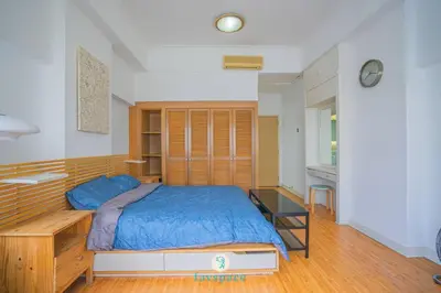 a bedroom with a large bed and a desk at Doorstep - Sunway Putra Mall - Close to PWTC for 4 in Kuala Lumpur
