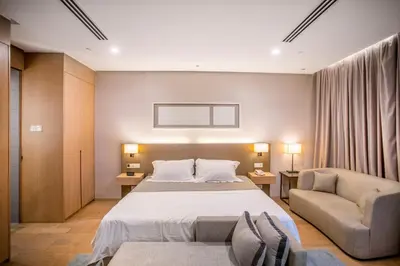 a hotel room with a bed and a couch at 188 Suites with Washer and Bathtub near KLCC Kula Lumpur in Kuala Lumpur