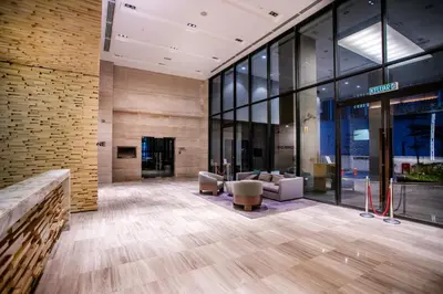 an empty lobby of a building with glass windows at 188 Suites with Washer and Bathtub near KLCC Kula Lumpur in Kuala Lumpur