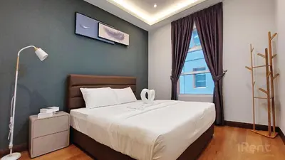 a bedroom with a large bed and a window at Private Room at Sky Suites KLCC by iRent365 in Kuala Lumpur